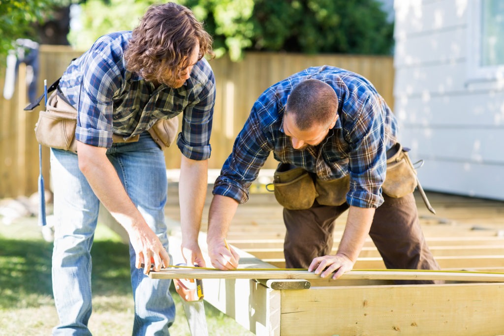 carpenters-building-treated-lumber-deck