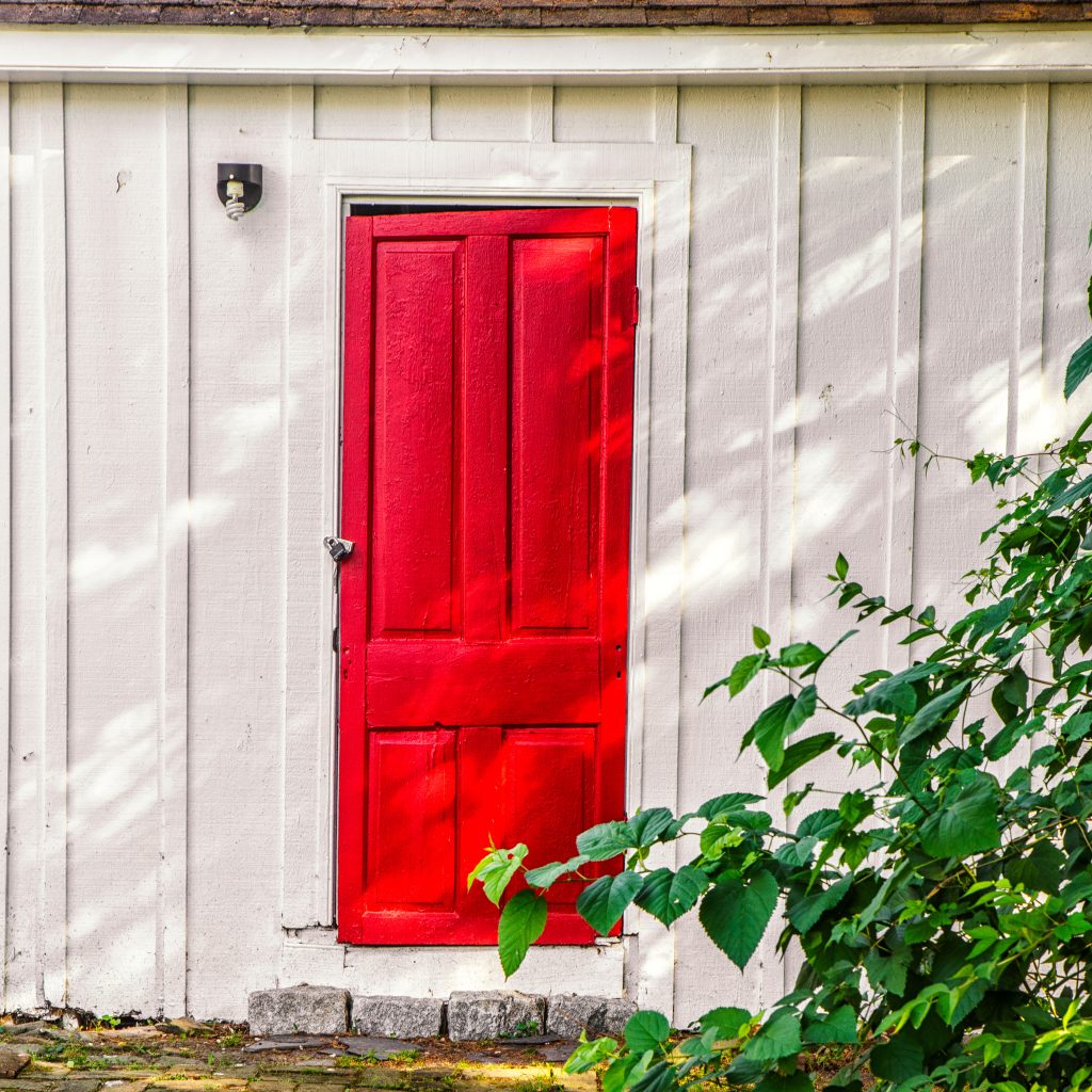 Red Door on White Building